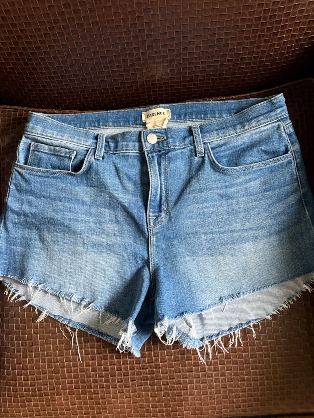 L'AGENCE Medium Wash Blue Distressed Denim Cutoff Shorts